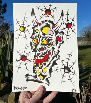 Traditional colour flash of a stone hannya with bullet holes 