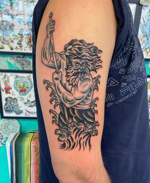 Traditional black and grey Poseidon tattoo