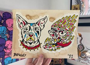 Traditional colour flash featuring a dog head and drippy skull 