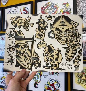Traditional black and grey flash featuring a goblin with a pistol, skeleton creeping with a dagger, skull with a top hat and pipe/dice/dollar sign, skull with peace ohm eye, rock formation 