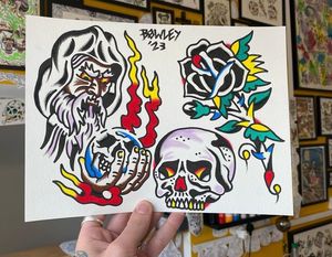 Traditional colour flash featuring a wizard with an orb and flames, a large black rose and a skull 