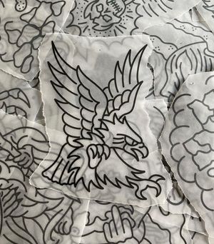 Traditional stencil flash featuring an eagle