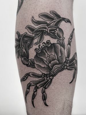 Detailed blackwork crab tattoo by Lukey Wolf, featuring intricate linework and shading for a unique and bold look.