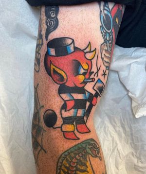 Bold and vibrant traditional devil tattoo by renowned artist Matt Bowley, featuring classic motifs and striking colors.