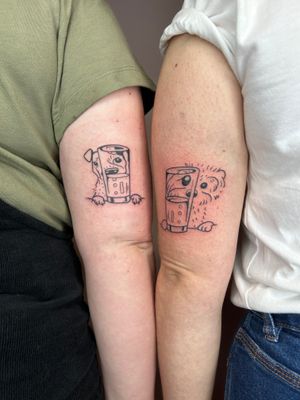 Adorn your skin with Jonathan Glick's whimsical tattoo featuring a dog, a glass, a drink, and a beloved pet. A delightful and unique piece of illustrative art.