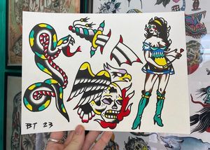 Traditional colour flash featuring a cleaning maid pinup, snake, dagger and eagle skull flames combo 
