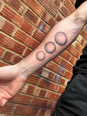 Experience the depth and beauty of this black and gray dotwork tattoo featuring a mesmerizing sphere. By artist Jonathan Glick.