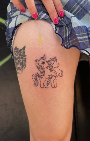 Get a beautifully detailed My Little Pony tattoo in fine line style by the talented artist Julia Bertholdi.