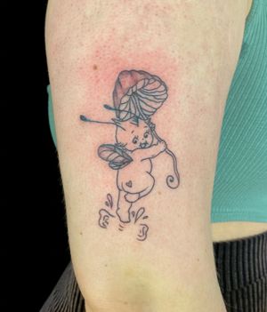 Get lost in the magic of this fine line and illustrative tattoo by Julia Bertholdi, featuring a whimsical fairy and mushroom motif.