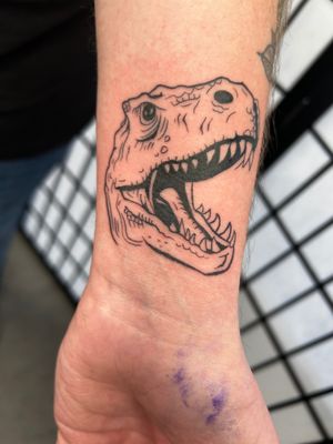 Get inked with this fierce and detailed T-Rex design by the talented artist Jonathan Glick. A perfect addition to your dinosaur tattoo collection!