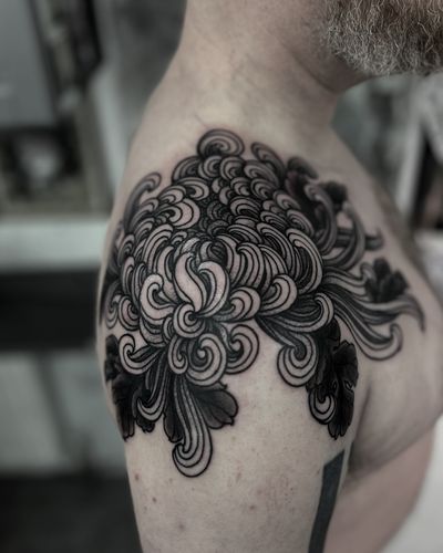 Beautiful blackwork flower tattoo by the talented Lukey Wolf. A stunning addition to your body art collection.