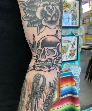 Get a bold and classic skull design by tattoo artist Matt Bowley in traditional style.