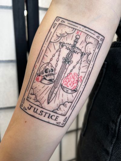 Experience the balance and fairness of justice with this intricate and symbolic illustrative tattoo by artist Jonathan Glick.