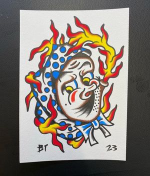 Traditional colour flash featuring a Hyotokko mask on fire 