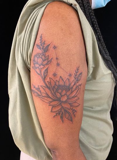 Experience the beauty of nature with this stunning lotus flower tattoo by the talented artist Julia Bertholdi. Perfect for those seeking a unique and elegant design.
