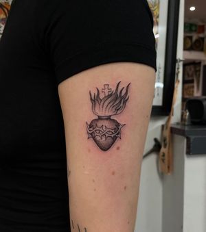 Experience the divine beauty of a sacred heart tattoo by the talented artist Julia Bertholdi. Embrace the spiritual symbolism in stunning illustrative style.
