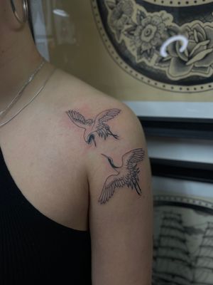 Elegant fine line and illustrative tattoo featuring a majestic crane or heron, expertly executed by Julia Bertholdi.