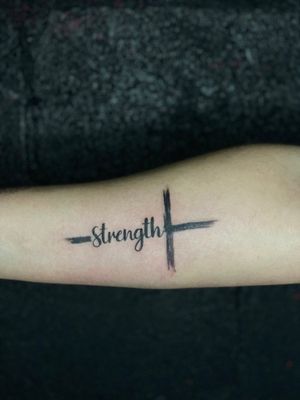 Strength/cross tattoo done by @jehtattoos.ink