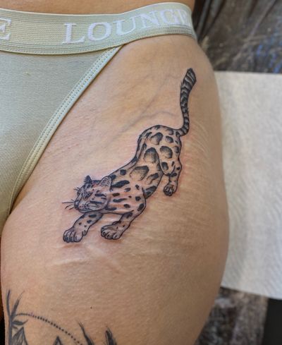Illustrative tattoo by Julia Bertholdi featuring a stunning leopard design to cover up scars.
