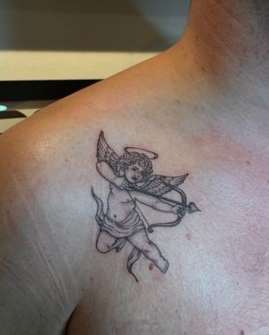 Get a stunning tattoo of an angel and cupid by Julia Bertholdi. This illustrative design will bring a touch of magic to your body.