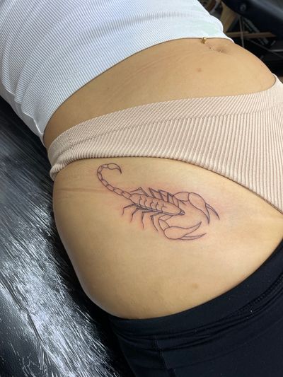 Experience the intricate detail and elegance of a fine line, illustrative scorpion tattoo by the talented artist Julia Bertholdi.