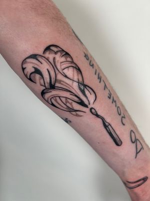 Get a striking and sophisticated blackwork match tattoo by the talented artist Jack Howard. Perfect for those seeking a bold and minimalist design.