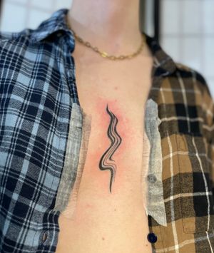 Bold and intricate blackwork design by artist Julia Bertholdi, with a unique and abstract motif that stands out.