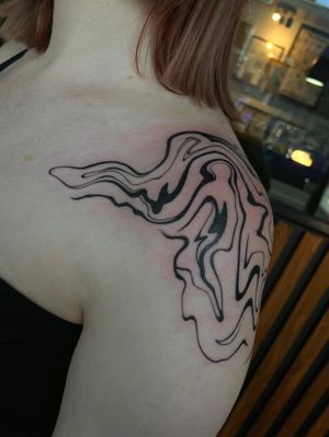 Unique and bold blackwork tattoo featuring abstract designs, expertly done by talented artist Julia Bertholdi.