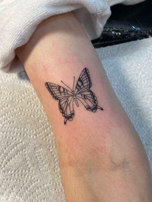 Bring some whimsical charm to your skin with a stunning butterfly tattoo by the talented artist Julia Bertholdi.