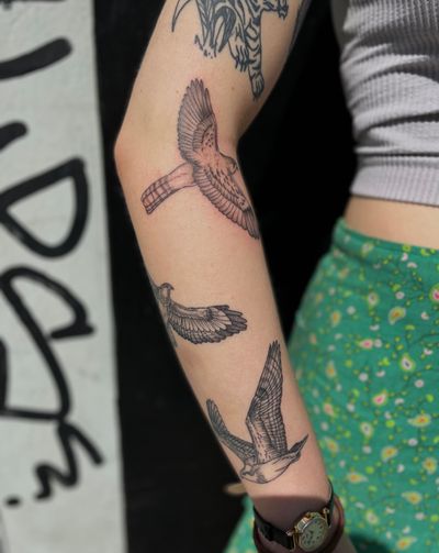 Get a unique illustrative tattoo featuring a colorful bird in a patchwork design, expertly done by Julia Bertholdi.