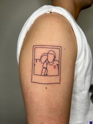 Get a unique and sentimental tattoo featuring a polaroid picture outline of your family with fine line details by the talented artist Jack Howard.