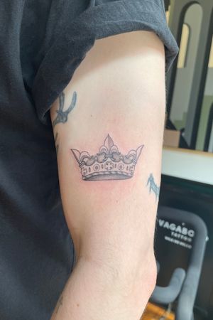 Make a regal statement with this unique illustrative crown tattoo designed by Julia Bertholdi. Fit for a king or queen!