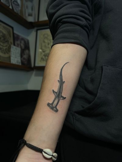 Dive into the depths with this stunning black and gray illustrative shark tattoo, expertly crafted by Julia Bertholdi.