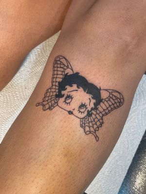 Get inked with this illustrative masterpiece by Julia Bertholdi combining the iconic Betty Boop with a beautiful butterfly design.