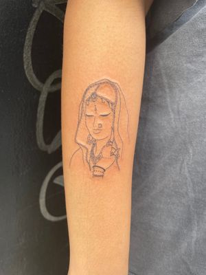 Experience the beauty of India with this intricately detailed fine line tattoo of a woman by Julia Bertholdi.