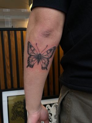 Graceful and detailed illustrative butterfly tattoo designed by the talented artist, Julia Bertholdi. A stunning addition to your body art collection.