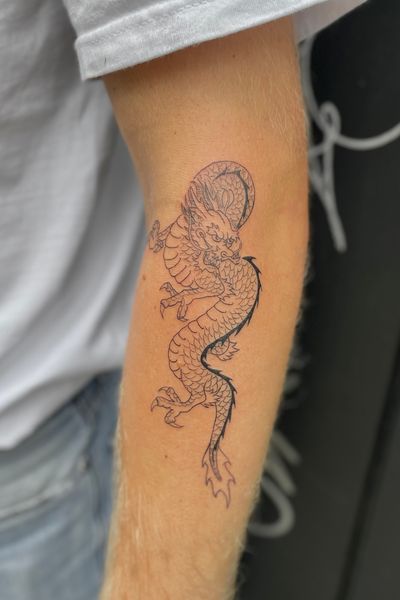Unleash the mythical with this stunning illustrative dragon tattoo, expertly crafted by Julia Bertholdi. Perfect for those who appreciate fine detail in their body art.