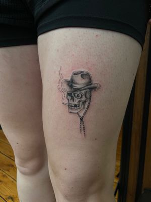Get a bold and unique illustrative cowboy skull tattoo by the talented artist Julia Bertholdi. A perfect blend of Western and macabre vibes!