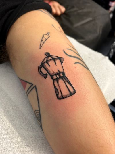 Unique blackwork tattoo by Jack Howard featuring a traditional Italian percolator with coffee motif.