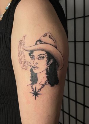 Embrace your wild side with this stunning cowgirl tattoo. Bold lines and vibrant colors bring this design to life. Perfect for those who love Western vibes.