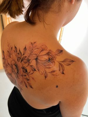 Elegantly designed fine line floral tattoo by Ion Caraman, featuring a beautiful flower motif. Perfect for those who appreciate intricate and detailed tattoos.