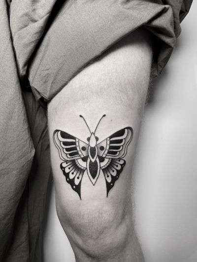 Get inked with a stunning butterfly design in classic blackwork style by the skilled artist tattsbybetts.