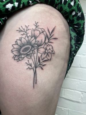 Experience the beauty of nature with this intricate dotwork sunflower tattoo. Hand-poked by the talented artist Marketa.
