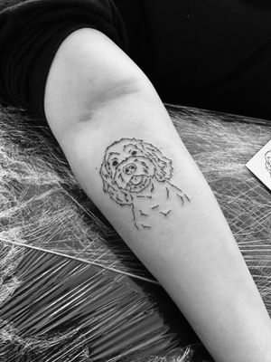 Exquisite illustrative tattoo of a beloved pet dog, created by renowned artist Oliver Soames. Fine lines bring this design to life with precision and style.
