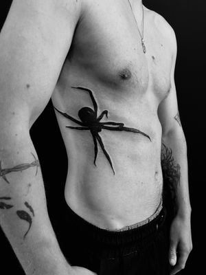 Experience the intricate beauty of a spider design by renowned artist Oliver Soames. Perfect for those who appreciate dark and detailed tattoos. 