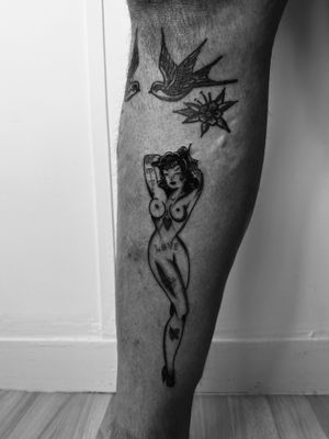 Get the timeless charm of a traditional pin up tattoo designed by the talented artist Oliver Soames.