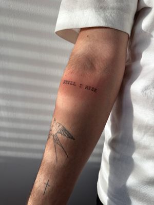 Elegantly designed small lettering tattoo by renowned artist Oliver Soames, perfect for a subtle and meaningful piece.