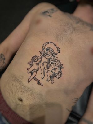 Experience the ethereal beauty of an angel in a traditional woodcut style with this expertly crafted tattoo by the talented artist Oliver Soames.