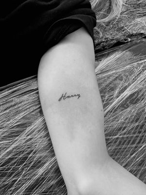 Experience the beauty of small lettering with this elegant script tattoo done by the talented artist, Oliver Soames.