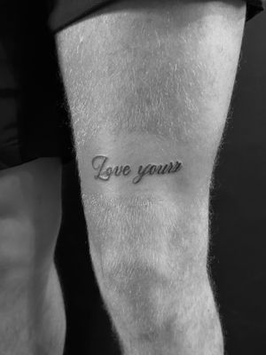 Get a stylish small_lettering tattoo done by the talented artist Oliver Soames. Express yourself with elegant lettering design.